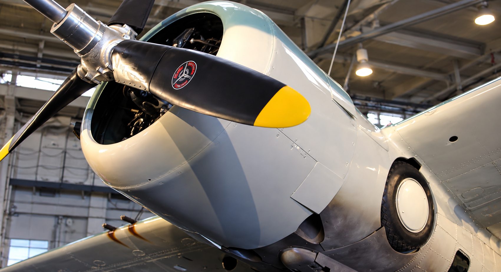 A restored World War II-era fighter plane on display in the hangar at Estrella Warbirds Museum, Paso Robles