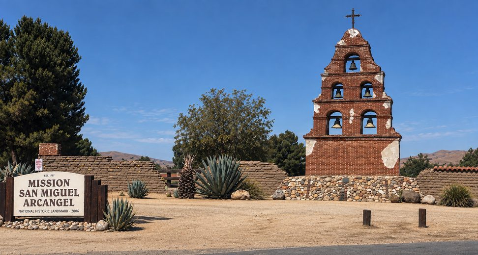 Mission San Miguel Arcángel bell tower and entrance sign