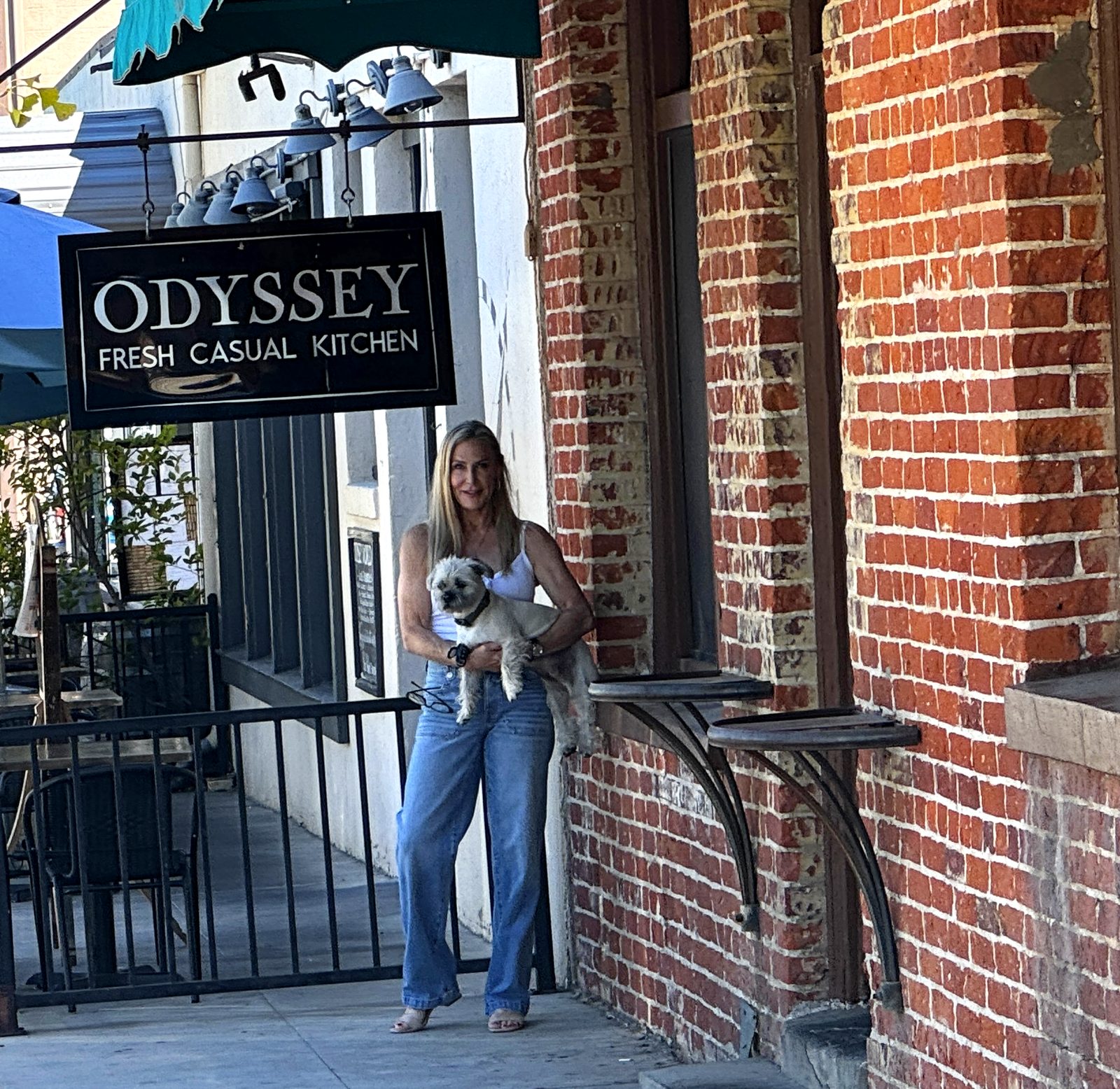 Leila and her dog outside Odyssey World Café, downtown Paso Robles